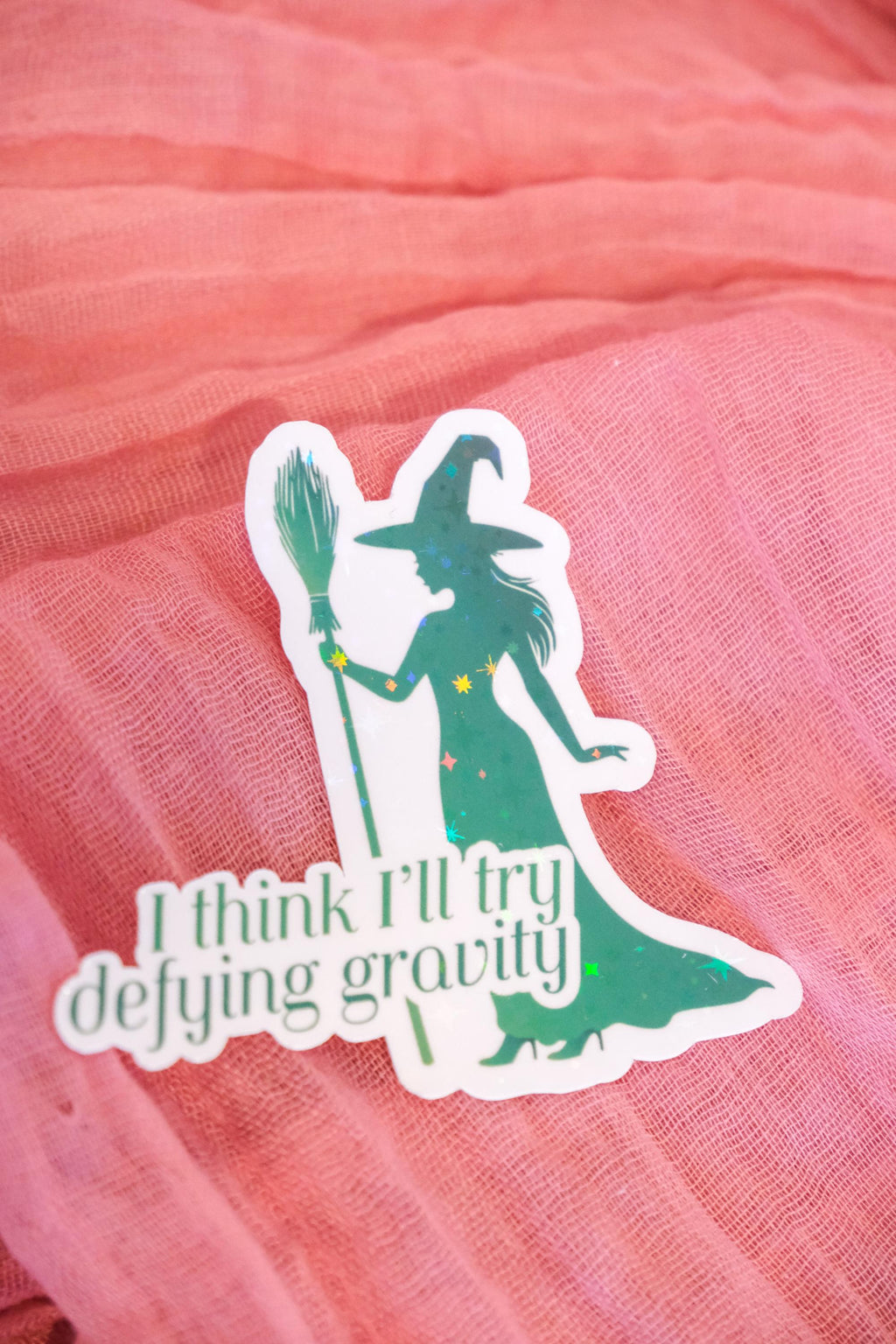 Defying Gravity Sticker