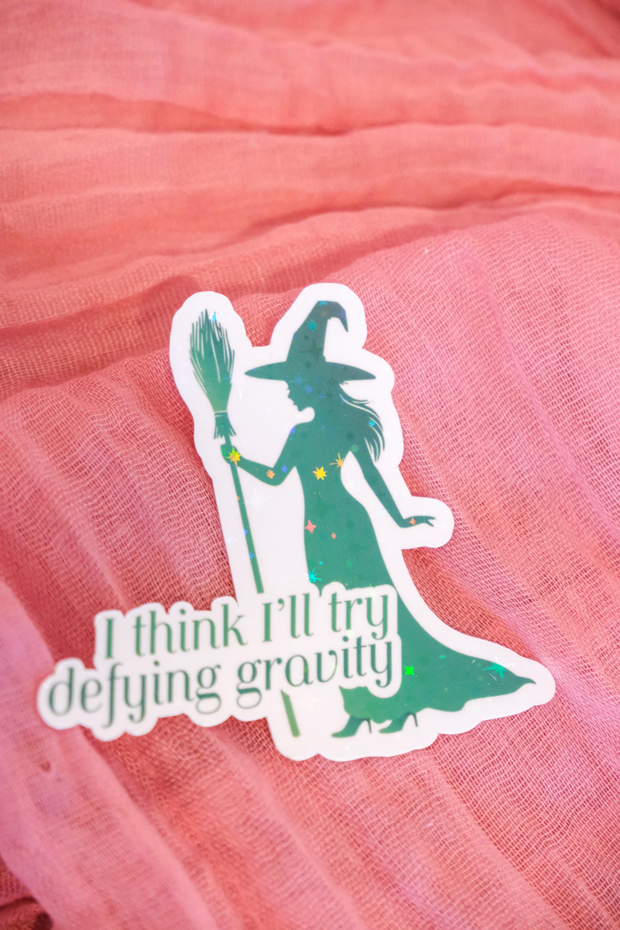 Defying Gravity Sticker